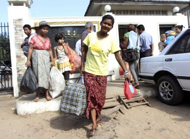 Myanmar prisoner walks outside Insein prison in Yangon, Myanmar after she was released today.