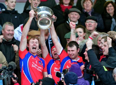 St. Thomas captain Robert Murray and his brother Richard lift the Tom Callanan Cup.