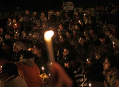 Indians hold a candle lit vigil for the 23-year-old medical student in New Delhi on Sunday