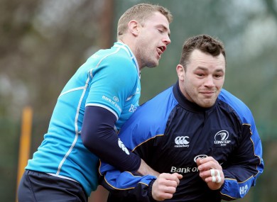 Jamie Heaslip and Cian Healy jostle in training.
