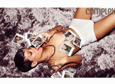 This is how Rihanna looks at photos. TAKE IT OUT OF YOUR MOUTH DEAR.