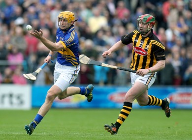 Kilkenny's Eoin Larkin and Shane McGrath of Tipperary.
