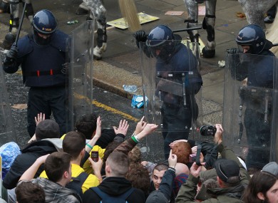 Students and gardaí in riot gear at the protest in November 2010.