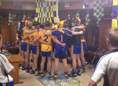 The Clare team get psyched up in a very colourful dressing room.