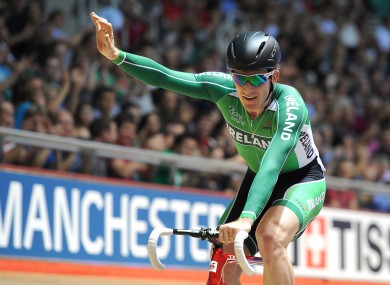 Ireland's Martyn Irvine celebrates winning gold in the Men's 30KM Points Race.