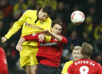 Robert Lewandowski and Leverkusen's Philipp Wollscheid last season.