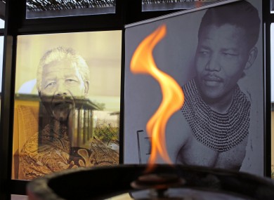 A flame burns in honour of Nelson Mandela at his childhood home of Qunu.