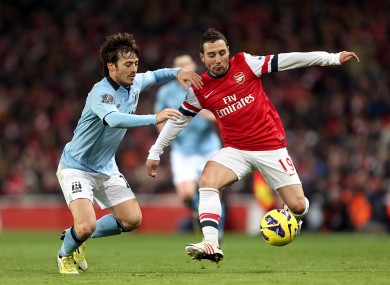 Arsenal's Santi Cazorla (right) and Manchester City's David Silva last season.