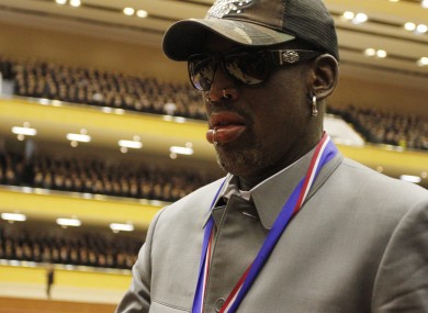 Dennis Rodman walks along the court at an exhibition basketball game between U.S. and North Korean players at an indoor stadium in Pyongyang.