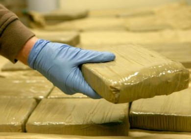 Garda handles seized heroin. (File photo)