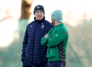 Paul O'Connell and Rob Kearney watch training this morning.