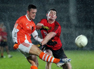 Armagh's Robbie Tasker in action with Down's Niall Madine.