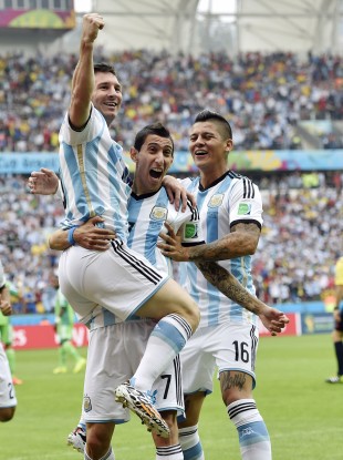 Messi, left, is carried by his teammates Argentina's Angel di Maria (7) and Marcos Rojo (16) after scoring his side's first goal.